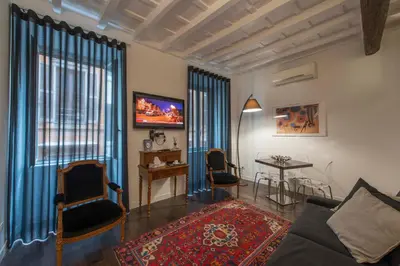 a living room with a couch and a table at EasyInRome Navona in Rome
