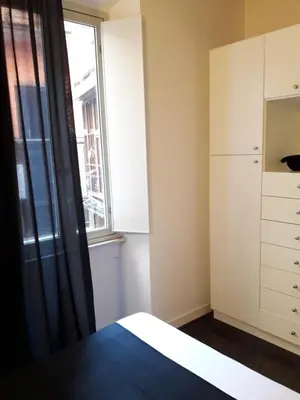 a bedroom with a bed and a window at EasyInRome Navona in Rome