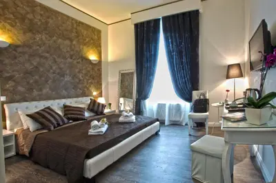 a bedroom with a large bed with towels on it at Rome Key Home in Rome