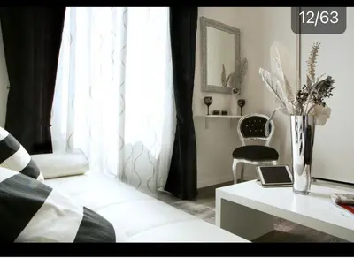 a living room with a couch and a table and a window at Rome Key Home in Rome
