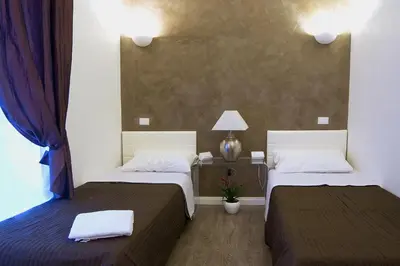 a bedroom with two beds and a window at Rome Key Home in Rome