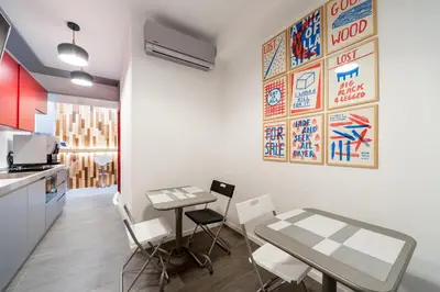 a kitchen with a table and chairs in a room at Il Rosso e il Blu in Rome