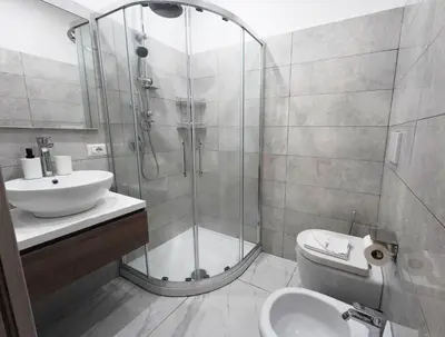 a bathroom with a shower and a toilet and a sink at Cicero Rome Center in Rome