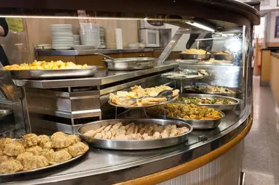 a buffet line with many different types of food at Cicero Rome Center in Rome