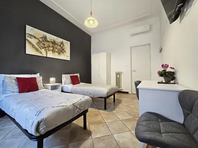a living room with two beds and a couch at Hosting Flats Hospety Group in Rome