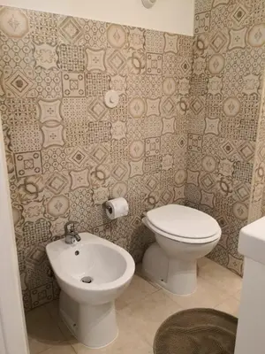 a bathroom with a toilet and a sink at Sergio Tourist Rental close Tiburtina Station in Rome