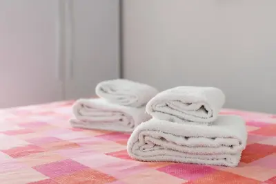 a pile of towels sitting on top of a table at La Casa In Prati in Rome