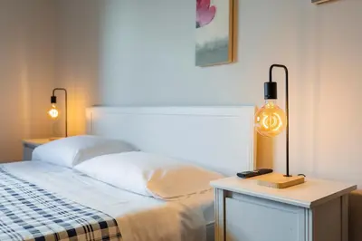 a bedroom with a bed and a table with a lamp at La Casa In Prati in Rome