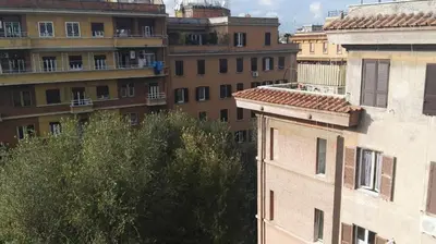 a view of a city with buildings and trees at Affittacamere Tiburstation in Rome