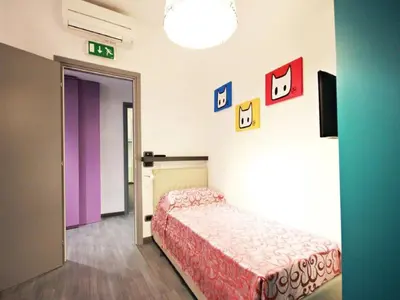 a bedroom with a bed in a room at Affittacamere Tiburstation in Rome