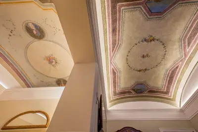 a room with ceilings with paintings on the walls at Hotel Canada, BW Premier Collection in Rome