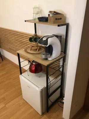 a telephone on a shelf in a room at Maison Vaticana in Rome