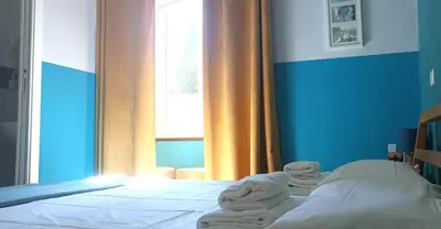 a bedroom with a bed with towels on it at Sweet Dreams Roma in Rome