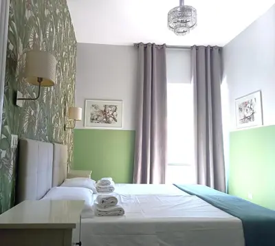 a bedroom with a bed and a window at Sweet Dreams Roma in Rome