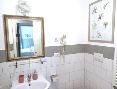 a bathroom with a sink and a mirror at Sweet Dreams Roma in Rome