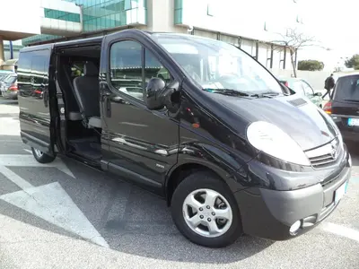 a black van parked in a parking lot with its door open at Enjoy Roma in Rome