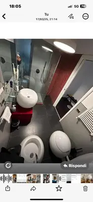 a bathroom with two sinks and two toilets at D.R.Rome Spanish Luxury Suites in Rome
