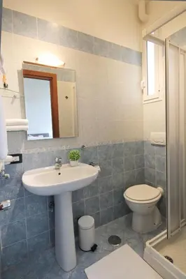 a bathroom with a sink and a toilet at San Pietro's Home in Rome