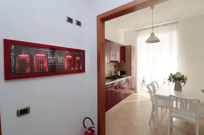 a kitchen and dining room with a table and chairs at Cardinal Vatican Inn in Rome