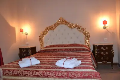 a bedroom with a bed with two towels on it at La Reggia dei Principi in Rome