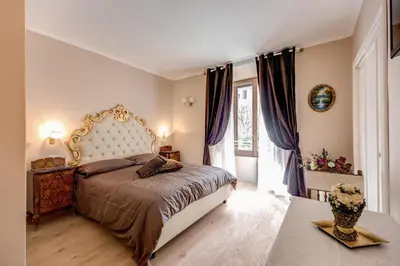 a bedroom with a large bed and a window at La Reggia dei Principi in Rome