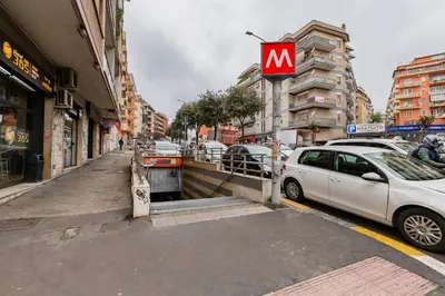 a mcdonalds sign on the side of a city street at Vatican 96 Degli Ubaldi Charming Suite with terrace in Rome