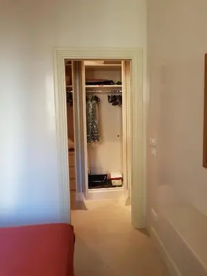 an empty room with a door to a closet at Popolo square deluxe flat in Rome