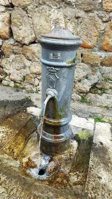 a fire hydrant on the side of a street at CASETTE DEI QUINTILI in Rome