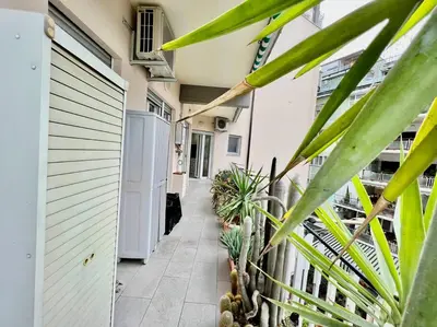a hallway of a house with plants and a fence at Lussuoso 130 MQ zona Cipro in Rome
