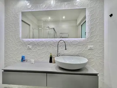 a white bathroom with a sink and a mirror at Lussuoso 130 MQ zona Cipro in Rome