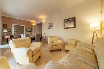 a living room with couches and chairs and a table at GuestHost - MM Cipro Elegant Apartment in Rome