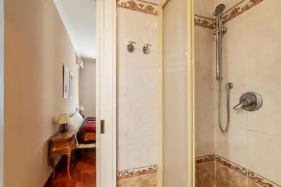 a shower with a glass door in a bathroom at GuestHost - MM Cipro Elegant Apartment in Rome