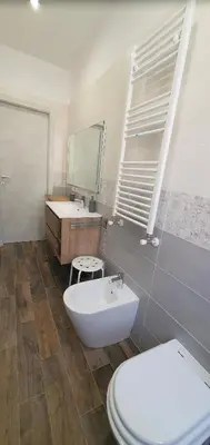 a bathroom with a white toilet and a sink at Vatican Apartment St. Peter in Rome