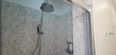 a shower with a glass door in a bathroom at Vatican Apartment St. Peter in Rome
