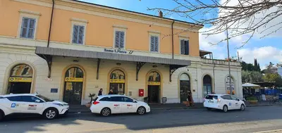 three white cars parked in front of a building at Vatican Apartment St. Peter in Rome