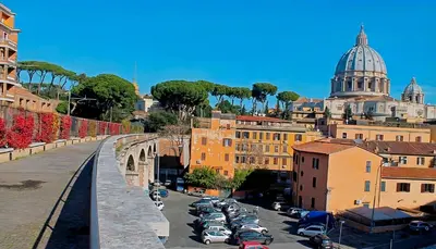 a view of a city with a bridge and parked cars at Vatican Apartment St. Peter in Rome