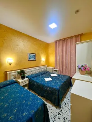 a bathroom with a sink and a shower and a toilet at Hotel Casali in Rome