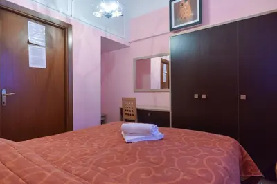 a bedroom with a bed with a towel on it at Gisa Rooms in Rome