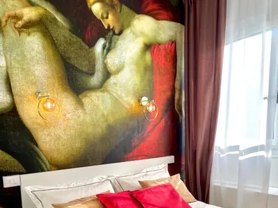a painting of a man and a woman on a wall at E&E Guest House in Rome
