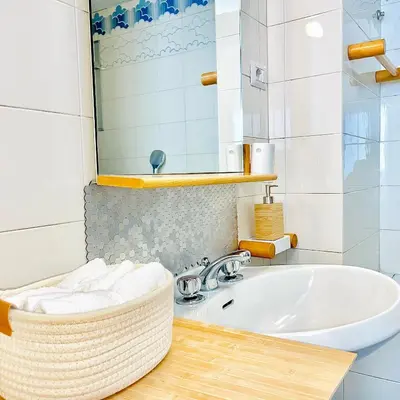 a bathroom with a sink and a mirror at E&E Guest House in Rome
