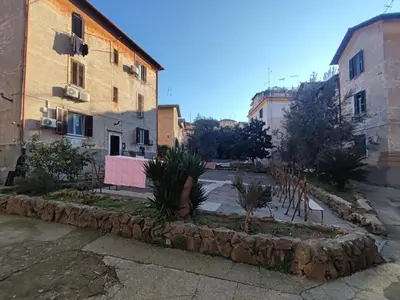 a street in a town with buildings and plants at Lotto 30 Metro Garbatella in Rome