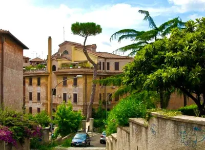 a building with a car parked in front of it at Lotto 30 Metro Garbatella in Rome