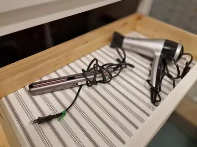 a pair of glasses sitting on top of a shelf at Giuditta San Pietro 52 Loft Roma in Rome