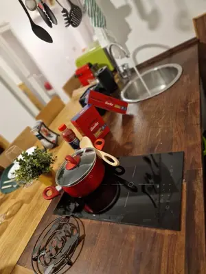 a counter top with a pot and a pair of scissors at Giuditta San Pietro 52 Loft Roma in Rome