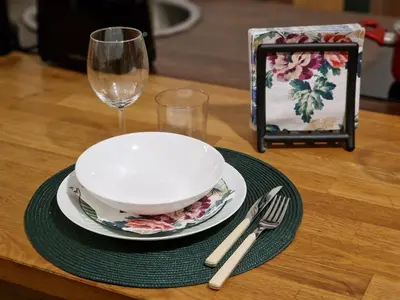 a table with a bowl and a plate and a wine glass at Giuditta San Pietro 52 Loft Roma in Rome