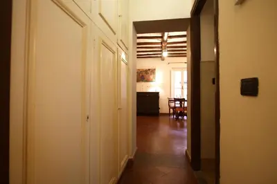 an empty hallway with a room with a table and a room at Pozzuolo Holiday House in Rome