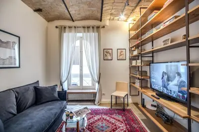 a living room with a couch and a tv at PgrHome Borgo Vittorio in Rome