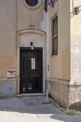 a building with a black door on the side of it at Testaccio Guest House in Rome