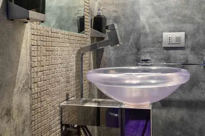 a bathroom with a white sink in a room at Manara 57 Dream Apartment Trastevere in Rome
