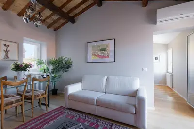 a living room with a couch and a table at Rome As You Feel - Luxury Terrace in Navona in Rome